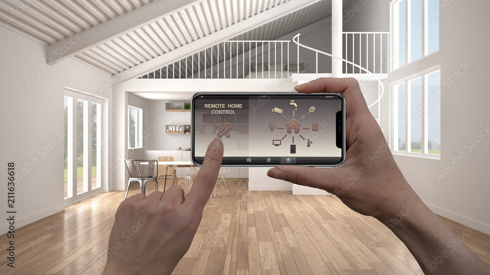 Remote home control system on a digital smart phone tablet. Device with app icons. Interior of minimalist white kitchen in the background, architecture design. Remote home control system on a digital smart phone tablet. Device with app icons. Interior of minimalist white kitchen in the background, architecture design.