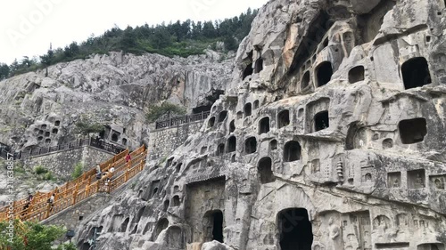 Panning view of the Longmen Grottoes in Luoyang, China