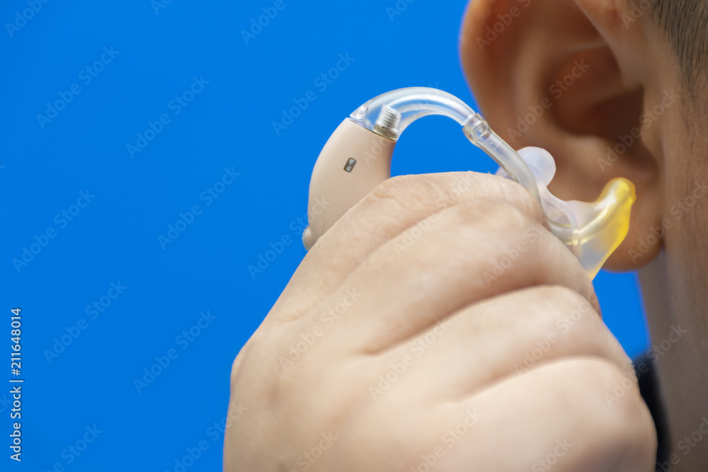 Fototapeta premium Hand that is catching hearing aid.
