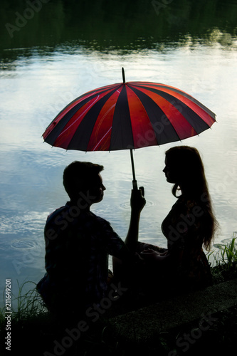 Young couple with umbrella