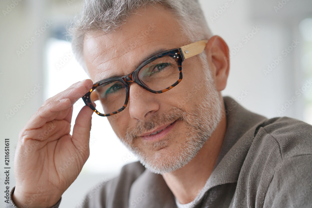 Portrait of smiling middle-aged man with eyeglasses Portrait of smiling middle-aged man with eyeglasses