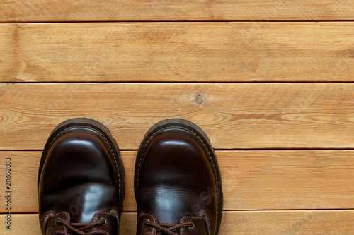 Male shoes on a wooden background.