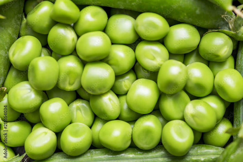 Green pea pod, green peas. Many fresh green peas as background Green pea pod, green peas. Many fresh green peas as background