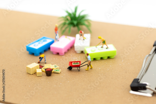 Miniature people: Farmers who sell rice trading business. Image use for business concept.