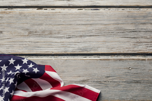 Fototapeta Naklejka Na Ścianę i Meble -  American stars and stripes flag on a white wooden plank background