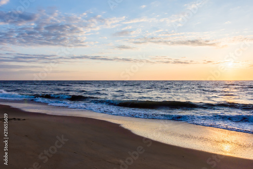 Fototapeta Naklejka Na Ścianę i Meble -  Beach sunrise or sunset with cloudy sky