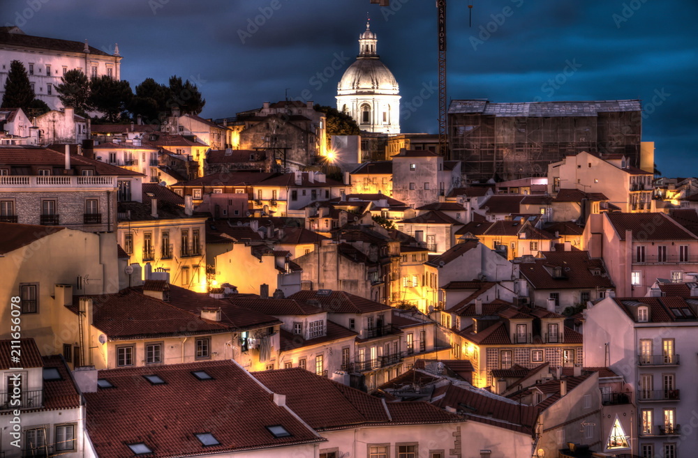View of old town of Lisbon at night from Miradouro de Santa Luzia
