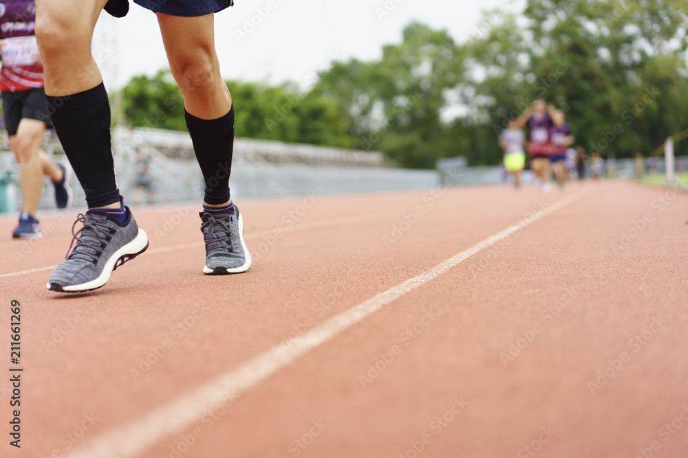 Group of people running race marathon