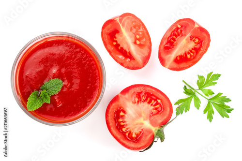 Tomato juice in glass and tomatoes with parsley leaves isolated on white background. Top view. Flat lay