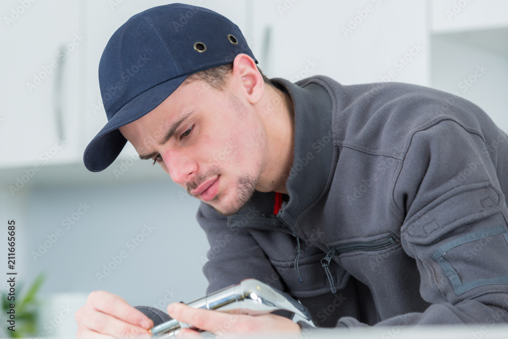 plumber fixing water tap in kitchen plumber fixing water tap in kitchen