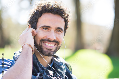 Man listening music outdoors