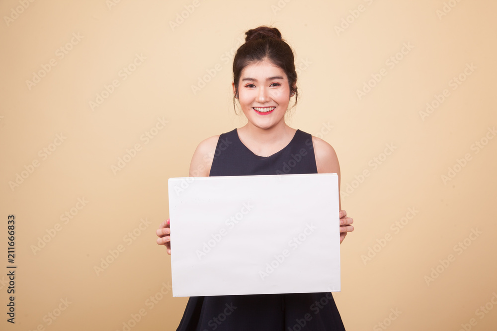 Young Asian woman with white blank sign. Young Asian woman with white blank sign.