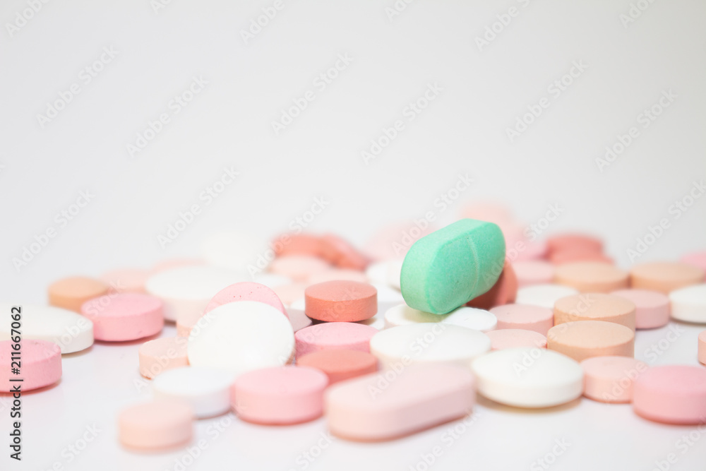 Numerous medicines Medications in the form of tablets. Colored pills on a white background. Numerous medicines Medications in the form of tablets. Colored pills on a white background.