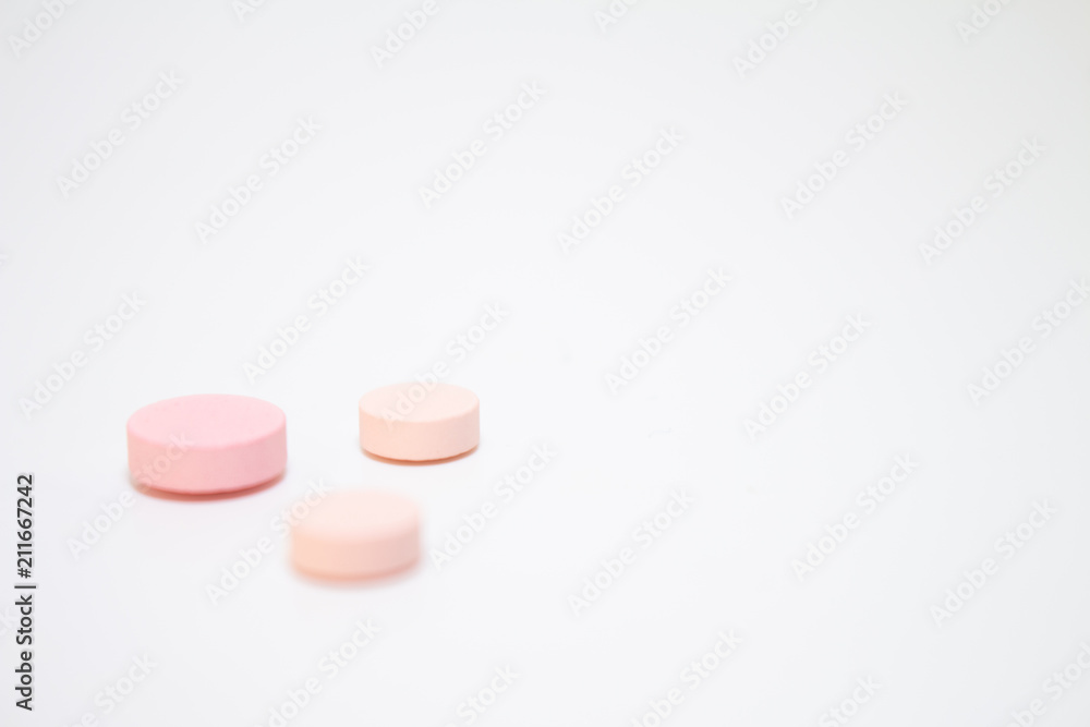 Numerous medicines Medications in the form of tablets. Colored pills on a white background. Numerous medicines Medications in the form of tablets. Colored pills on a white background.