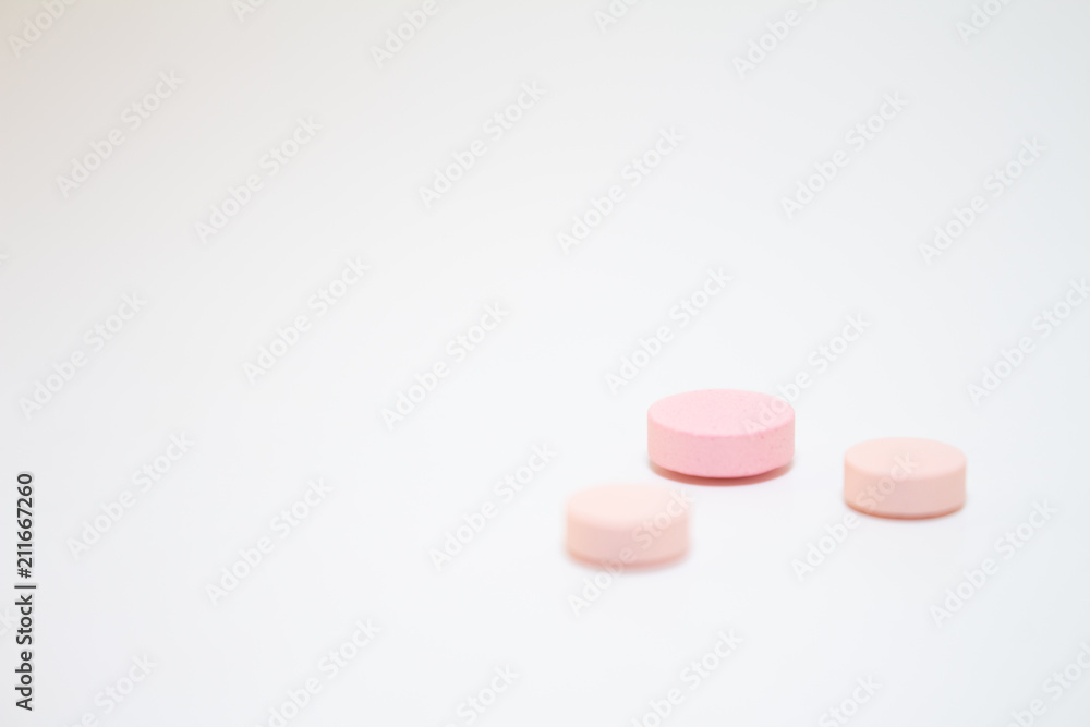 Numerous medicines Medications in the form of tablets. Colored pills on a white background. Numerous medicines Medications in the form of tablets. Colored pills on a white background.