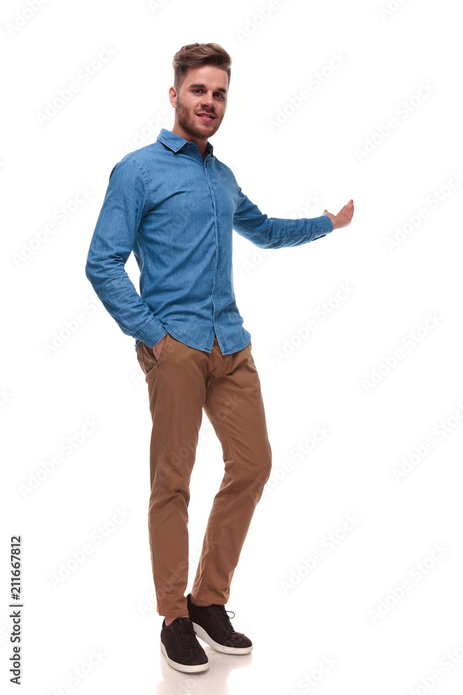 relaxed casual man standing and presenting behind relaxed casual man standing and presenting behind