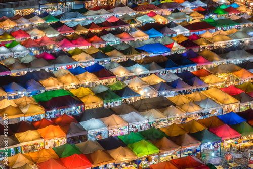 Aerial view,Bangkok Train market secondhand market at sunset time. Bird eyes view of Multi-colored tents /Sales of second-hand market at twilight - Panorama picture in Bangkok, Thailand