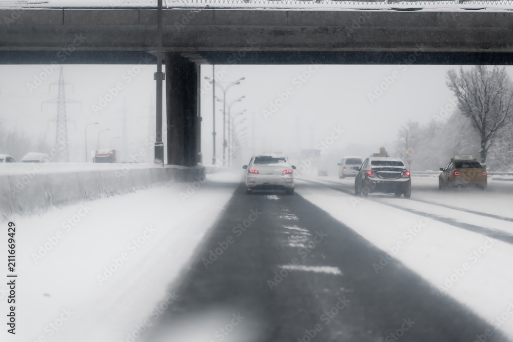 snowstorm, poor visibility,slick roads and lots of traffic snowstorm, poor visibility,slick roads and lots of traffic