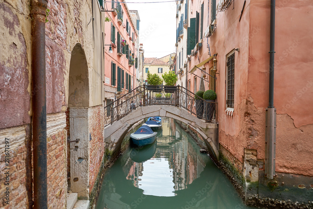 Typical small canal in Venice with nice bridges and boats