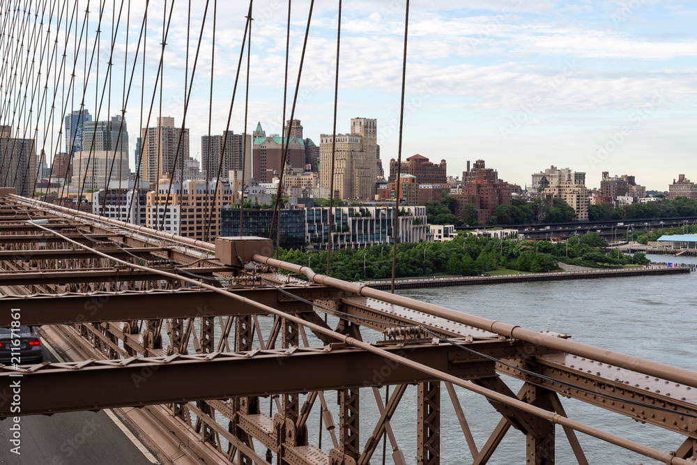 Obraz premium New York City / USA - JUN 20 2018: Brooklyn Bridge with buildings at early morning in New York City