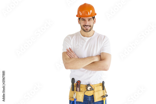 Handyman portrait. Young construction worker wearing hard hat and tool belt against white isolated background photo