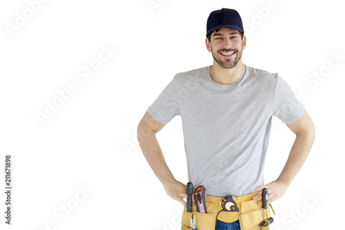 Valokuva Portrait of young handyman standing at isolated white background with copy space