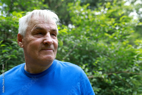 Senior man posing at backyard