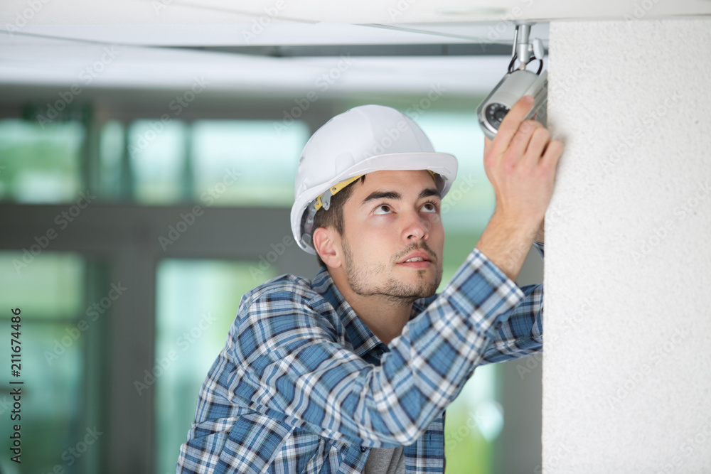 young professional cctv technician working young professional cctv technician working