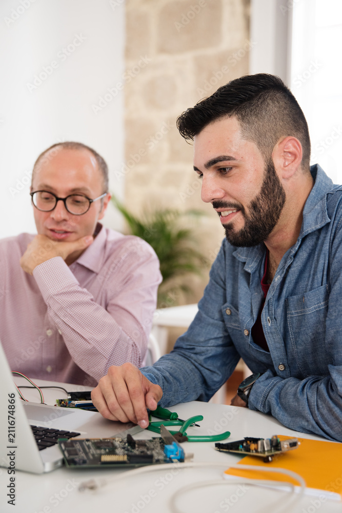 Two business men looking at a computer Two business men looking at a computer