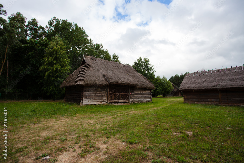 Barn with a thatched roof in a village in Poland
