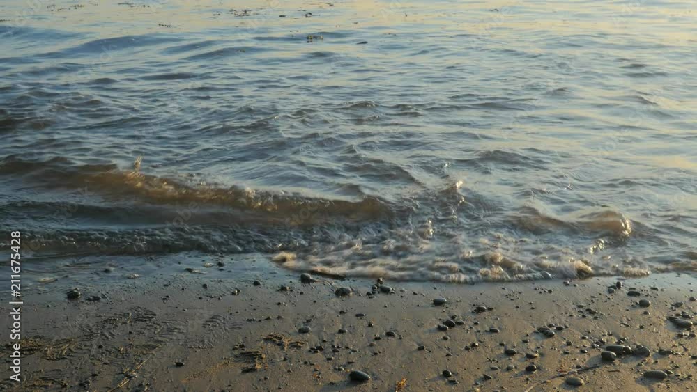 Lower half small boy running from ocean waves. Lower half small boy running from ocean waves.