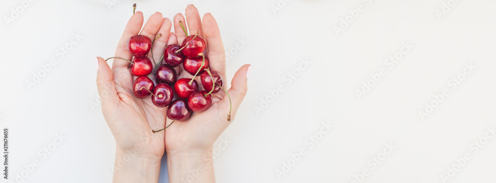 Fresh ripe cherry in a female hands Fresh ripe cherry in a female hands
