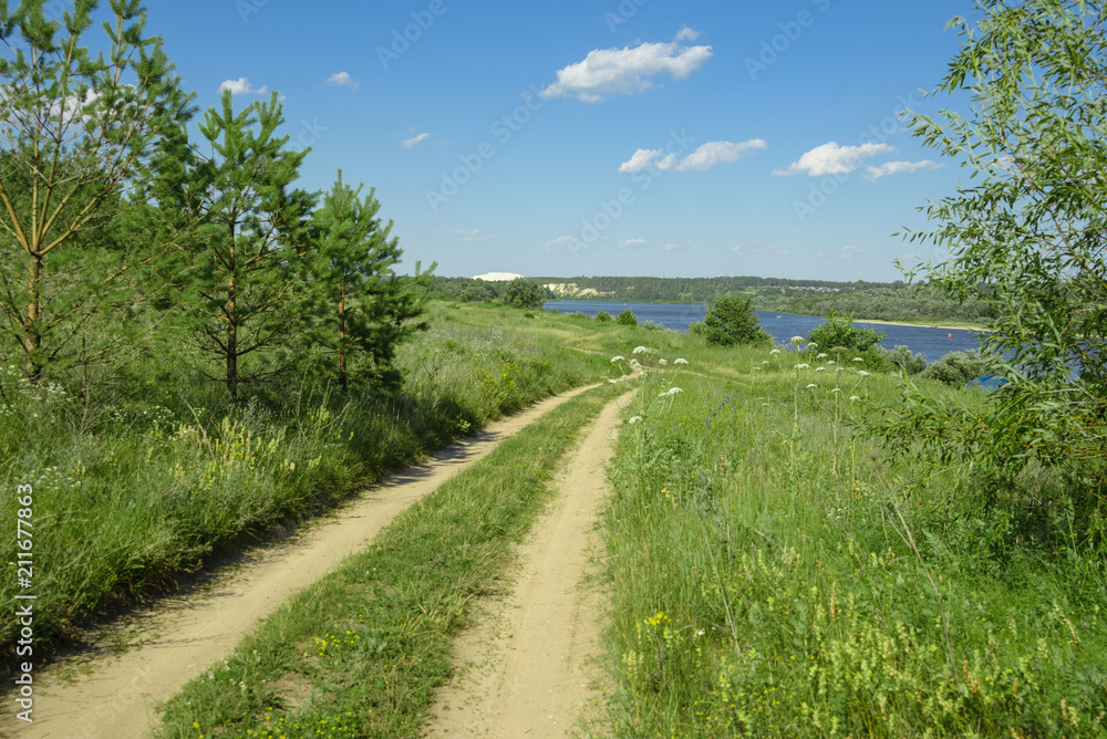 a picturesque view, a road along the river