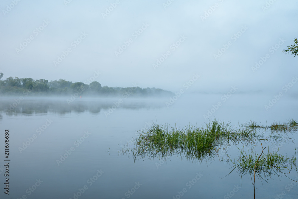 Morning on a river with fog, fishing
