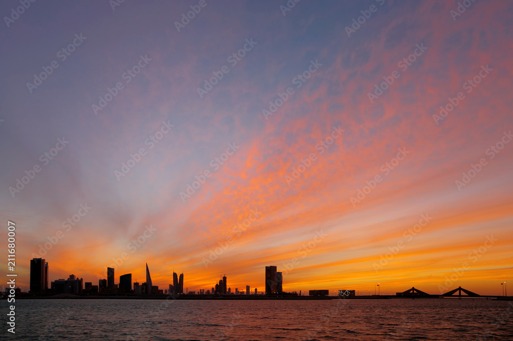 Bahrain skyline and dramatic sky at sunset Bahrain skyline and dramatic sky at sunset