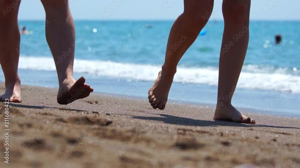 Selective focus. Sandy beach, defocused people. Selective focus. Sandy beach, defocused people.