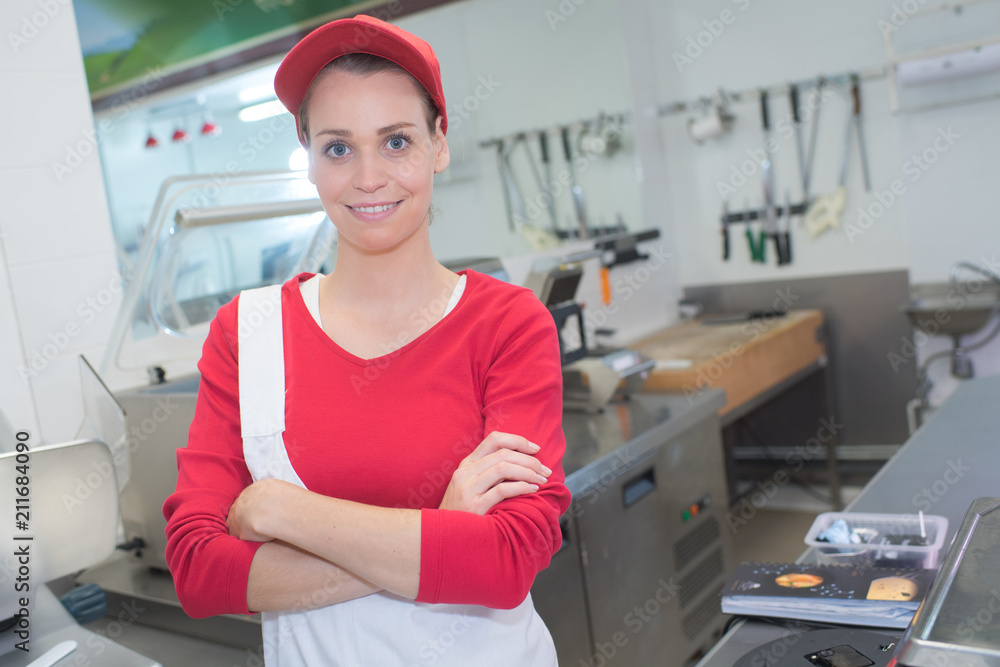 cheerful female butcher on supermarket cheerful female butcher on supermarket