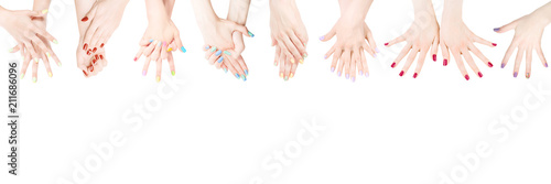 Hands with colored nail polish set in the row photo