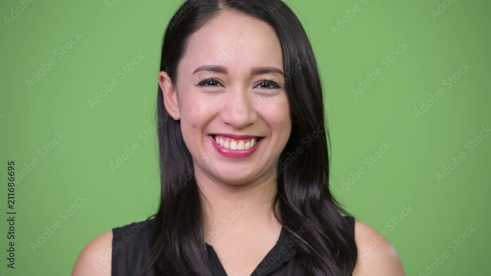 Young beautiful Asian businesswoman smiling Young beautiful Asian businesswoman smiling