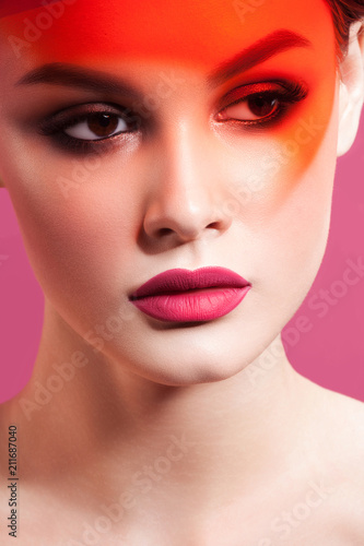 Young beautiful woman with clean perfect skin with orange filters