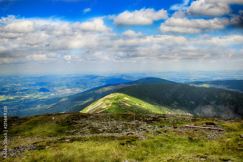 The highest mountain Snezka in national park Krkonose in Czech republic. There is beautiful view and scenery. The hill is in the clouds. The highest mountain Snezka in national park Krkonose in Czech republic. There is beautiful view and scenery. The hill is in the clouds.