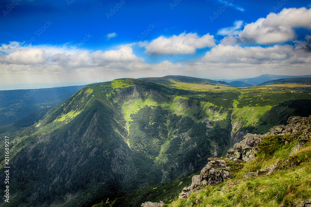 Fototapeta premium The highest mountain Snezka in national park Krkonose in Czech republic. There is beautiful view and scenery. The hill is in the clouds. 