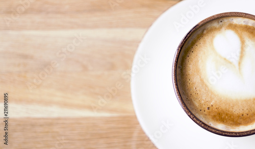 Girl having a break with cup of coffee, close up, soft focus, vintage filter.