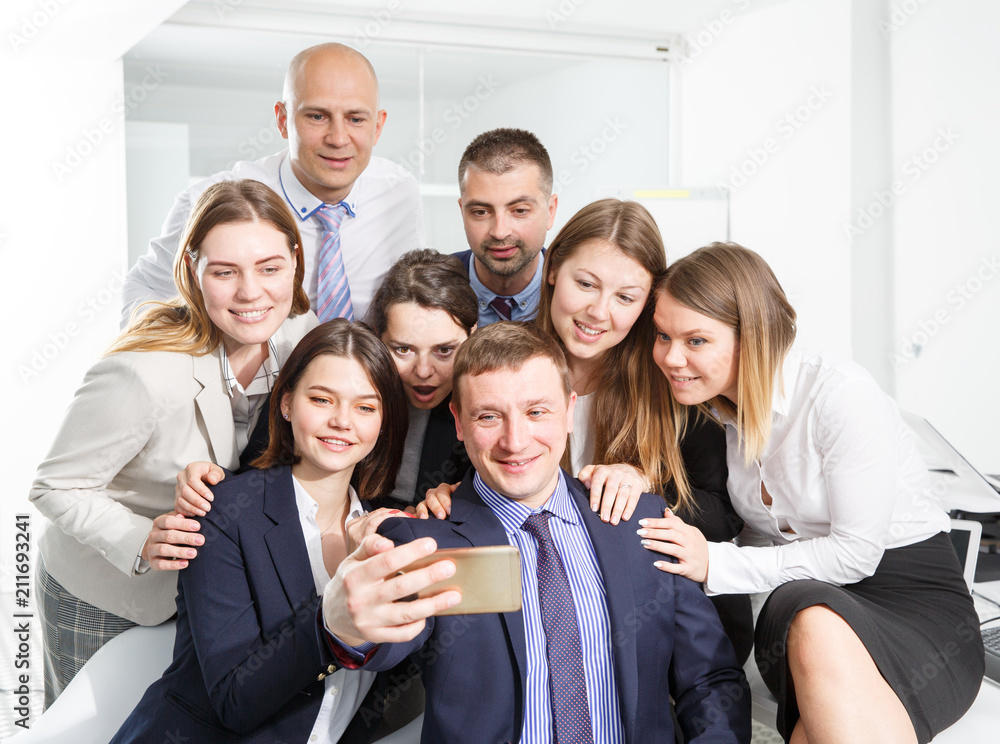 Fototapeta premium Cheerful group of business people making selfie