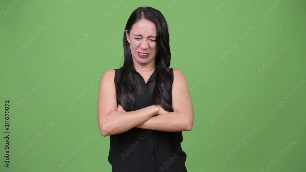 Young beautiful Asian businesswoman looking angry Young beautiful Asian businesswoman looking angry