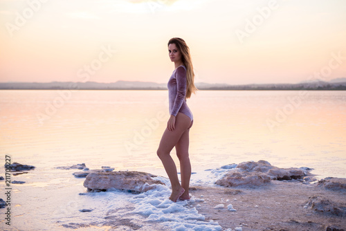 Pretty young girl in swimsuit at the beach
