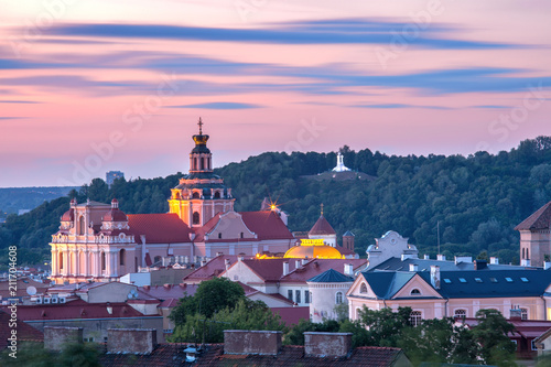 Aerial view over Old town with Church of St Casimir and Three Crosses on the Bleak Hill at sunset, Vilnius, Lithuania, Baltic states.