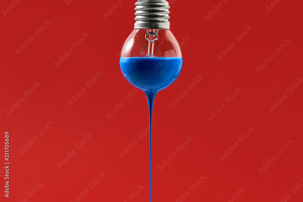 Bulb with blue paint on it - obrazy, fototapety, plakaty 