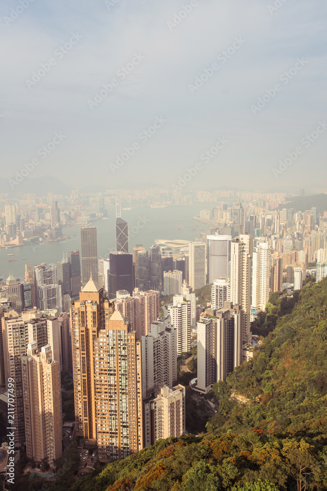 beautyful View of Hongkong urban and Victoria Harbor on sunset, toned picture