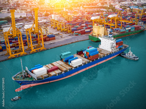 Logistics and transportation of Container Cargo ship and Cargo plane with working crane bridge in shipyard at twilight, logistic import export and transport industry background